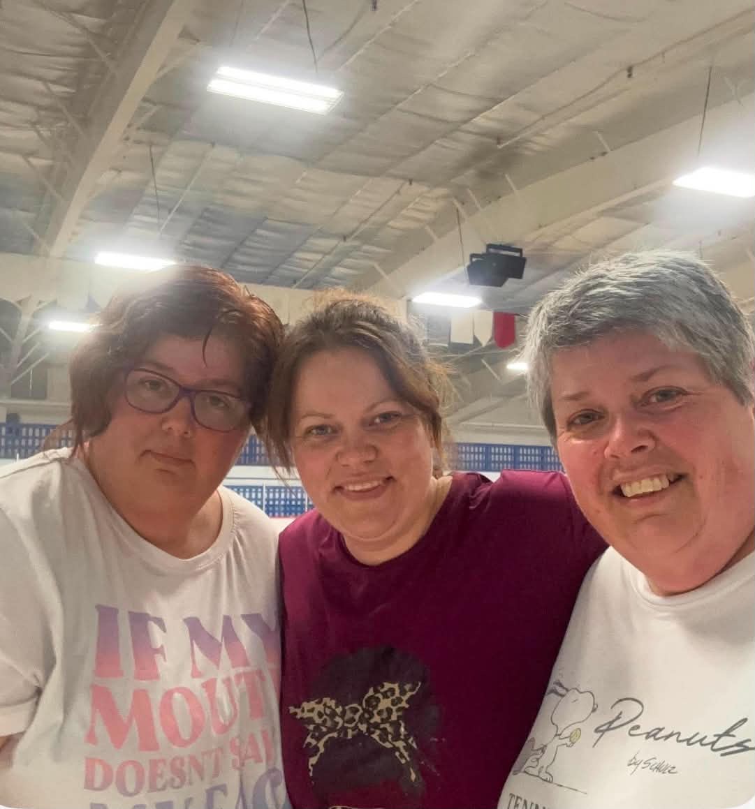 three sisters hugging before the walking group