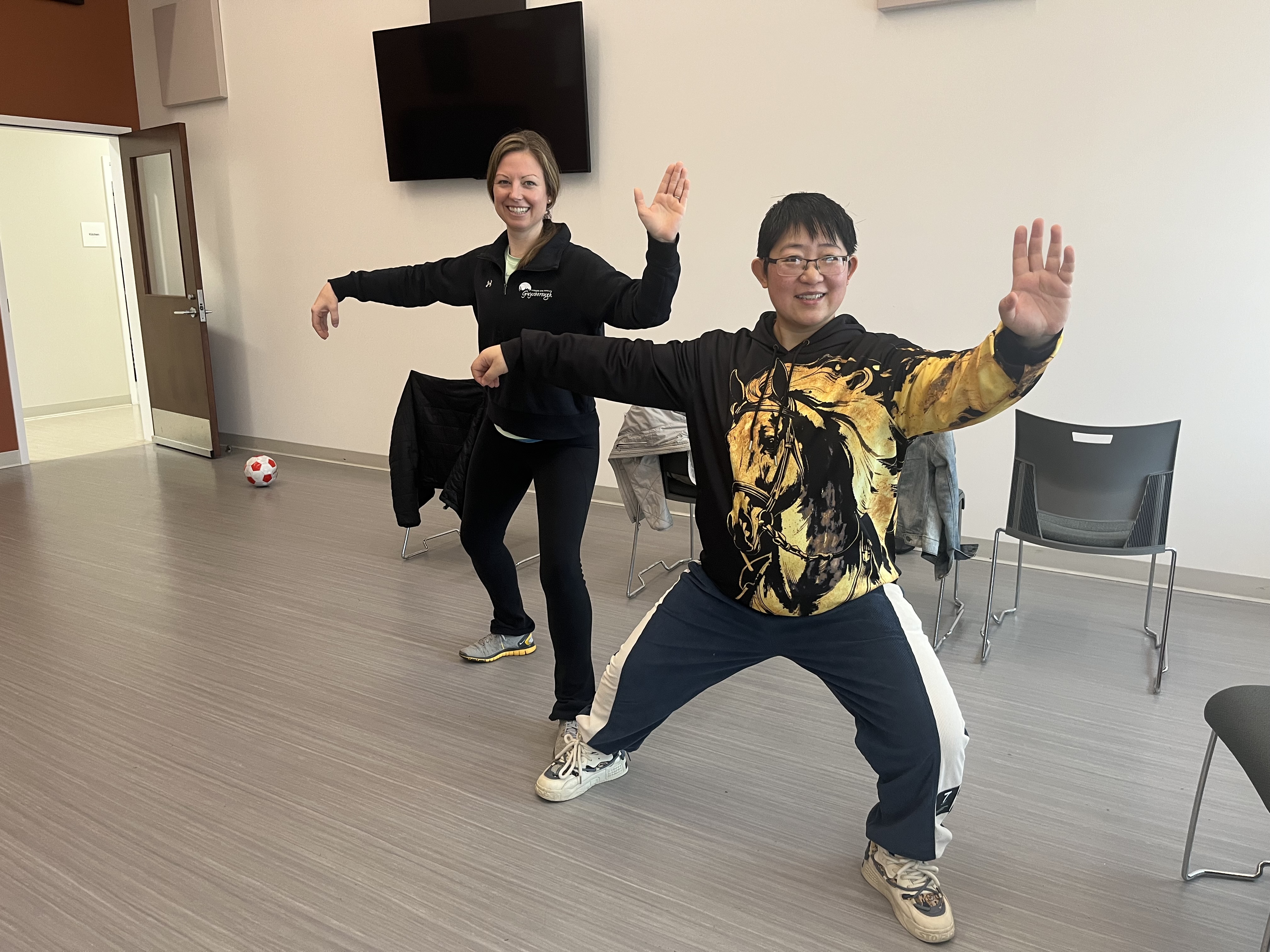 Two people in a Tai Chi pose