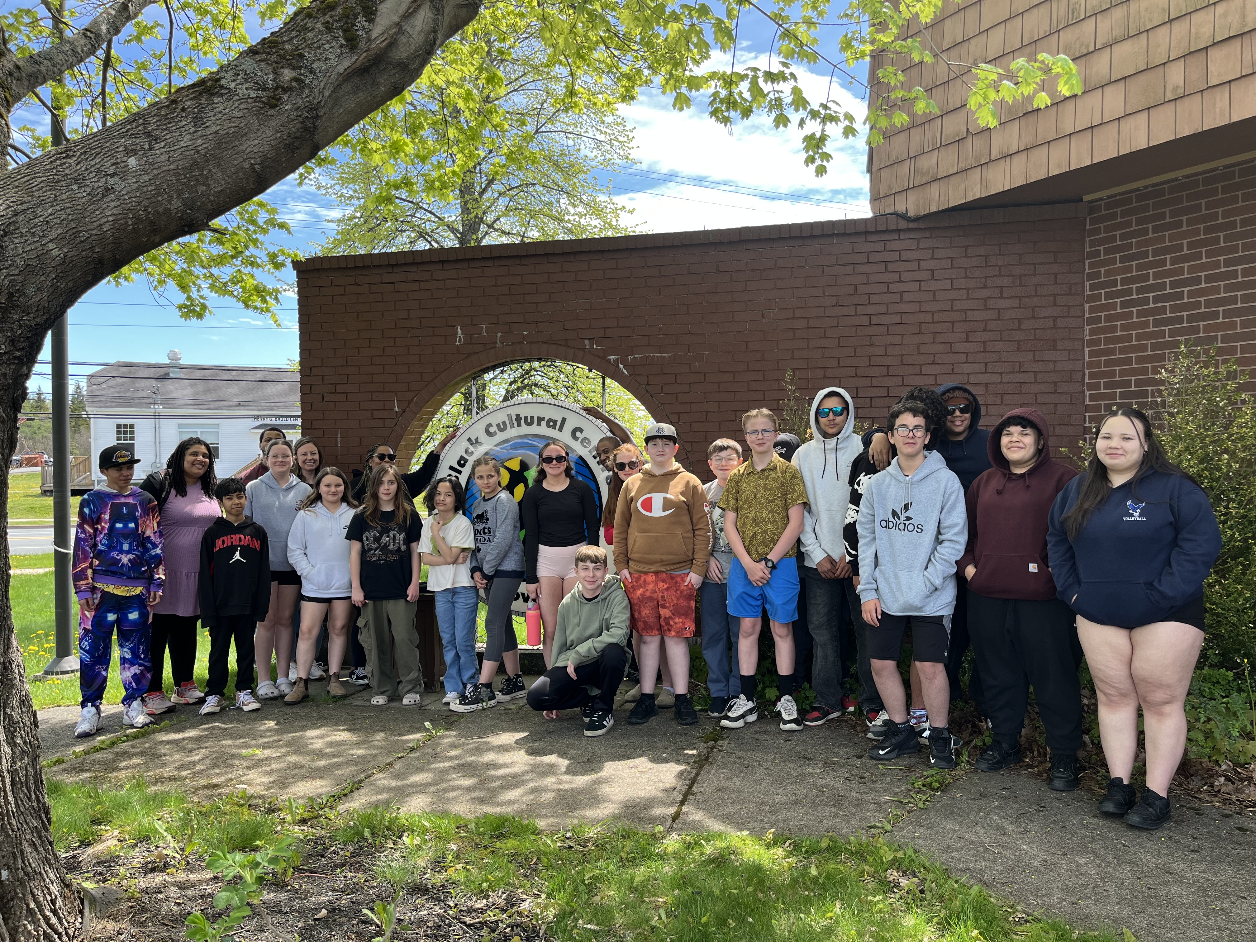 Students and chaperones gather outside the Black Cultural Centre sign